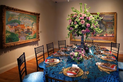Paintings by Pierre Bonnard inspired bright-blue linens and tall pink and spring-green centerpieces.