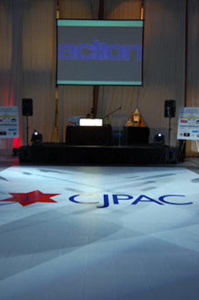 Le DJ created a custom white vinyl dance floor with the organization's logo.