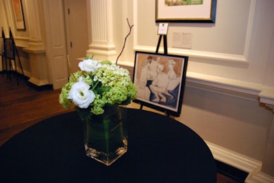Simple floral arrangements topped cocktail tables.