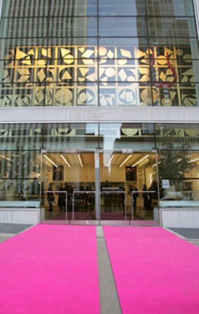 In lieu of a red carpet, guests at the black-tie affair strode down a hot-pink carpet into the Harris Theater.