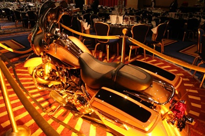 A Limited Edition Harley-Davidson—one of the high-end items up for auction—sat in the middle of the dining room.