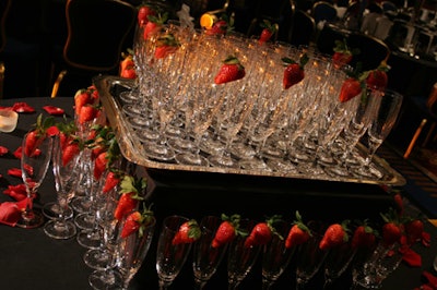 A center table offered champagne flutes with strawberries.