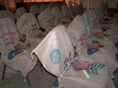 Chairs in the live-auction area were covered with burlap bags and tied with straw bows.
