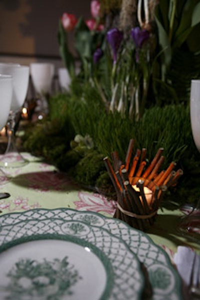 Twiggy votives added to the outdoorsy feel of Mille Fiori's cherry-tree-topped table.
