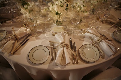 Used as napkin rings and chair ties, rope provided an interesting contrast on Bowman Dahl's elegant all-white table.