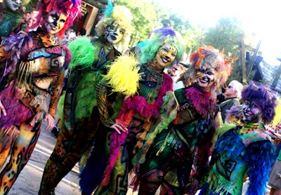 Dancers in body-hugging costumes mixed and mingled amongst the crowd.