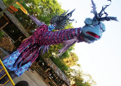 Stiltwalkers in whimsical tribal-inspired costumes surprised guests as they casually roamed throughout the gala.