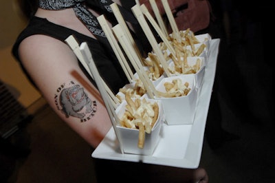 Servers with bandannas and fake tattoos passed hors d'oeuvres such as fries topped with mayonnaise.