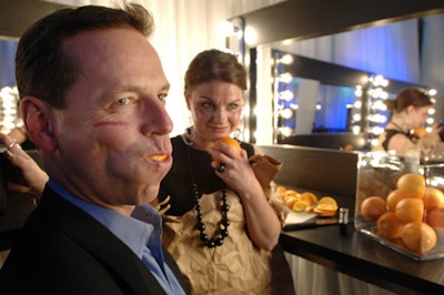 At Jesika Joy's installation, guests could have their makeup done. Part of the process was eating an orange slice.