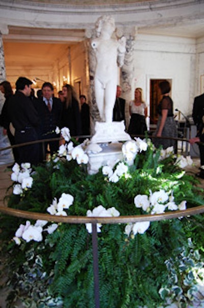 Ferns and orchids surrounded a nonfuctioning fountain that features a statue by Michelangelo.