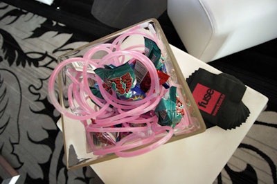 The design team filled glass boxes with glow-in-the-dark necklaces and ring-pop candy for the 'Pop' room.