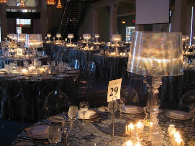 Tealights and Lucite lamps topped tables in the dining room.