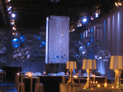 Shimmer screens of crystal beads and oversize silver balloons hung from the ceiling above the bar.