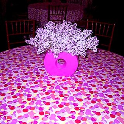 The tables were covered with Pucci-style polka dot tablecloths; the centerpieces were lilacs.