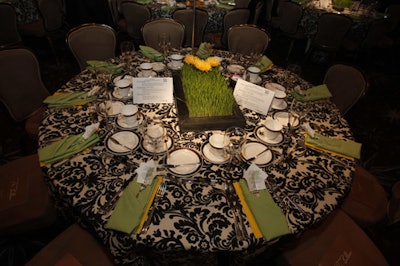 Centerpieces with wheatgrass and gerbera daisies evoked the look of a sports field.