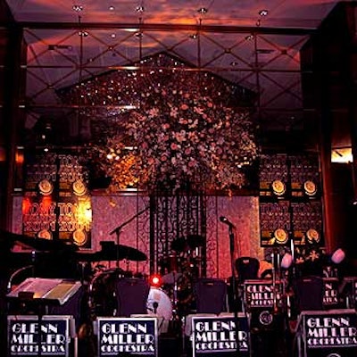 The Glenn Miller Orchestra performed on a stage decorated with flowers from Macres and posters from the Tony awards.