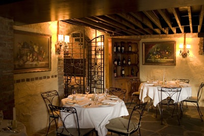 A labyrinth of wine cabinets and metal doors create quiet spaces throughout the cellar.