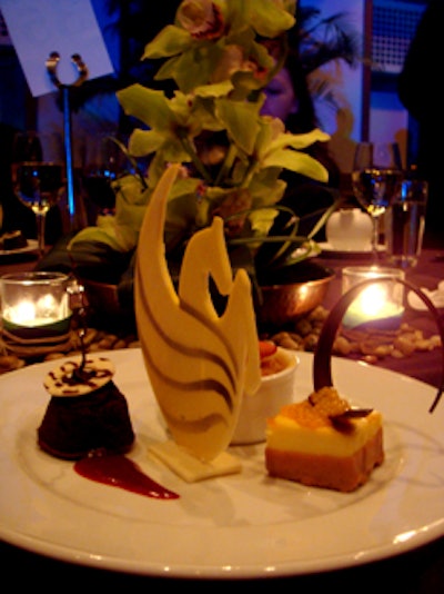 The Royal Pacific Trio dessert featured mango cheesecake, mini chocolate gooey cake, and coconut bread pudding accompanied by aPegasus chocolate garnish.