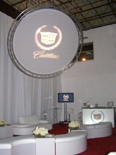 The Cadillac-sponsored lounge area featured contemporary white furniture from Room Service Furniture and Event Rentals.