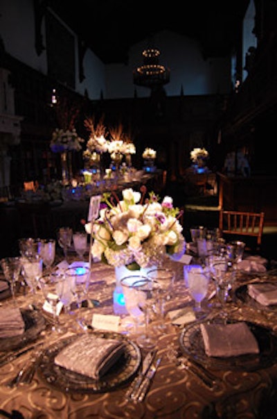 The dinner's mostly white centerpieces varied from short to tall, some reaching four feet into the vaulted ceiling of the old reading room.