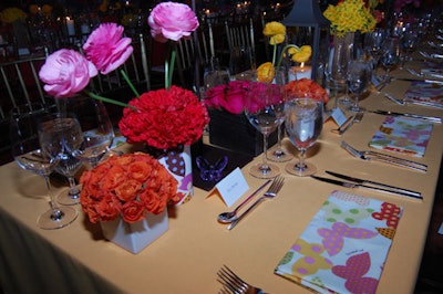 A diverse selection of flowers were arranged in short ceramic vases, wooden boxes, and even wrapped with a Missoni butterfly print designed especially for the night.