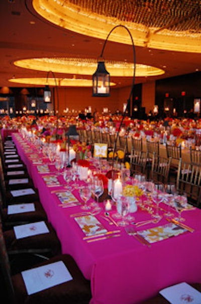 Alternating tables were lit by hanging lamps or hovering hurricane votives.