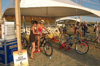 Global Inheritance's Energy Factory installation included an opportunity for attendees to power devices like cell phone chargers and misting fans using the energy generated by pedaling bikes.