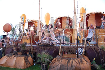 Lucent Dossier performed on a stage rigged with water-squirting features to cool guests.