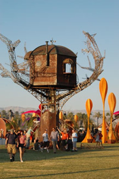 A treehouse-like art installation towered over the wide-open concert venue.