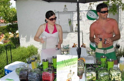 Guests could muddle their own cocktails using ingredients including berries and jalepeños at a Patron bar station at GQ's party.