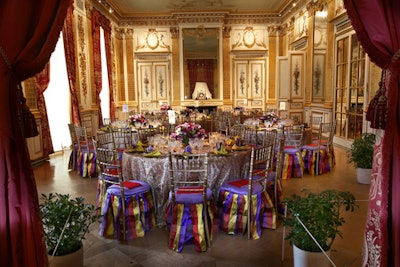 One of the more coveted dining spaces, Salon D'Or ('Salon of Gold'), featured purple, yellow, and red plaid chair skirts, with gold silk organza linens and ruby-red plates.