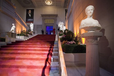 Garden hedges flanked the red-carpeted grand staircase and the museum's marble sculptures.