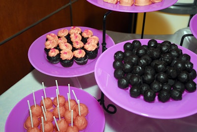 Desserts included mascarpone cheesecake lollipops covered in pink chocolate and mini red-velvet cupcakes topped with pink icing.