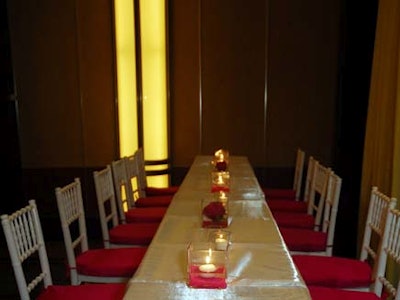 The Once Upon a Prom benefit paired long white tables with chairs covered with hot-pink satin cushions.