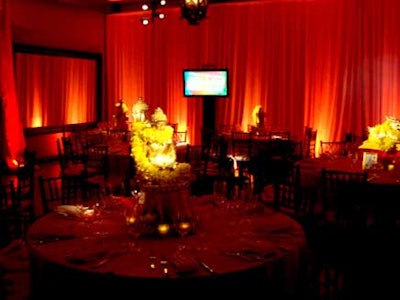 The walls of the indoor dining areas were draped in red linens and accented with gold and orange ambient lighting.