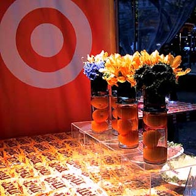 Rand. M Productions designed the Target Art in the Park event in Madison Square Park, which included clear Plexiglas tables made by the Industrial Plastic Supply, flowers by Marc-Antoine Floral Studio, and banners by Graphic Systems.