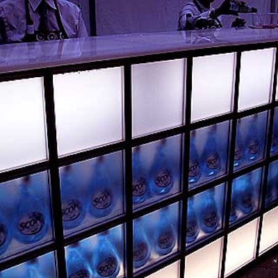Rand. M Productions designed this frosted plastic bar with blue bottles of Scope mouthwash on display. The bar was built by Agam Group.