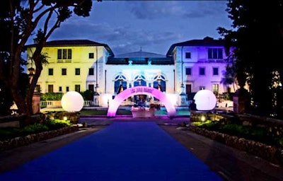 The historic mansion was drenched in colorful lighting, courtesy of Apara Productions.