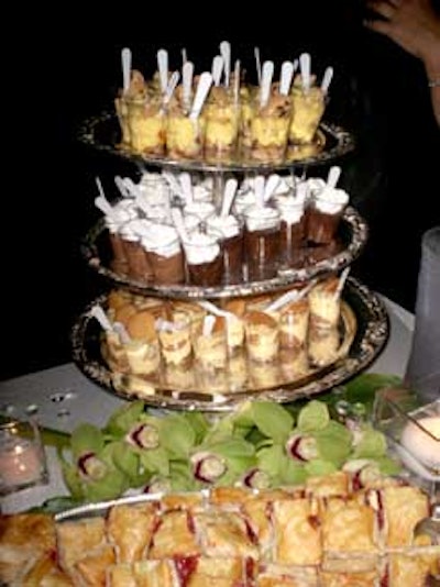 Mena Catering created a tower of mini desserts accented by green orchids.