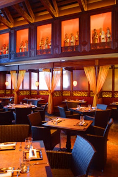 Rattan seating and circular and square tables fill up the main dining room.