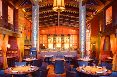 Soaring ceilings and hand-carved timber beams accent the main dining room.