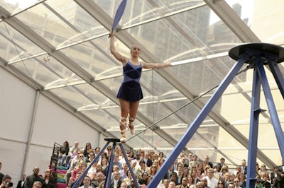 A tightrope walker joined acrobats, contortionists, and other circus-style performers.