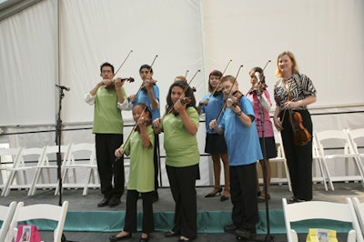 Young violinists played for the group.