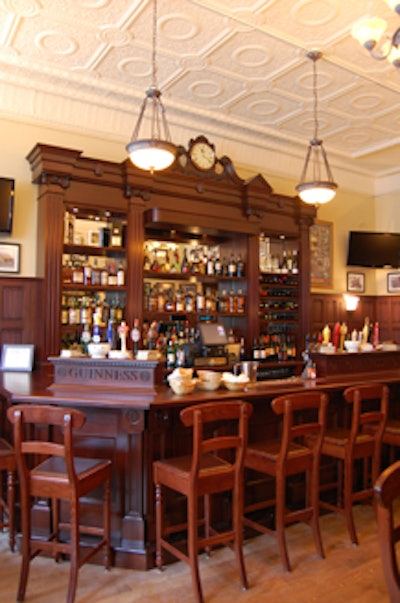 A hand-carved clock is a focal point at the bar, constructed from mahogany imported from Ireland.