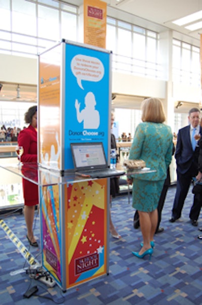 The reception included kiosks for guests to put $100 (given as a voucher at the start of the evening) toward the educational program of their choice.