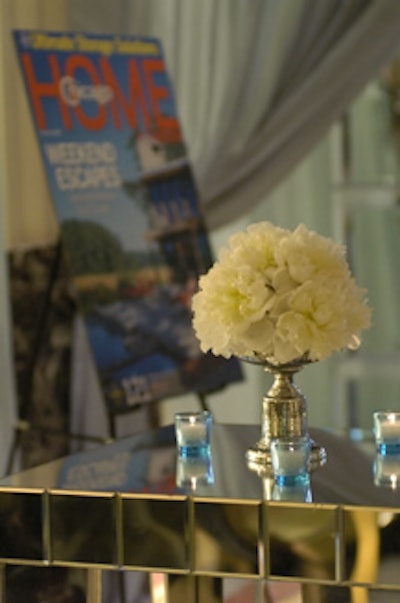 White flowers and blue votives added to the serene color scheme.