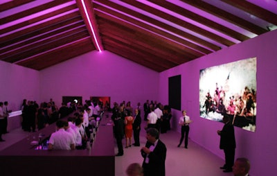 A tent with wood-framed ceilings housed the party's front room, which featured large LED projections of great American paintings, such as Emanuel Gottlieb Leutze's Crossing the Delaware.