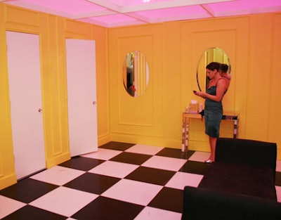 The temporary bathrooms hid Porta Potties behind a pink-tented, orange-walled room, with retro checkered floors.