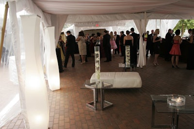 Atlantic Media took a prime spot by the pool, under a white tent set with low leather seating and glass-and-metal coffee tables.
