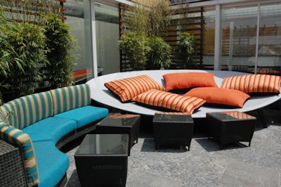 Highbar's outdoor area has a giant bedlike piece of furniture designed for lounging.